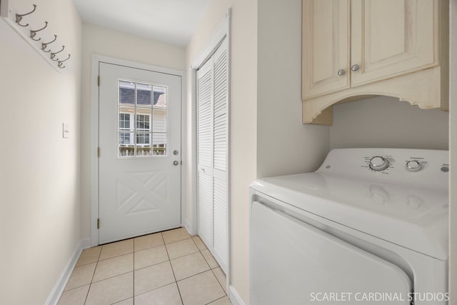 532 E Hawthorne Blvd, Wheaton, IL 60187 - washroom with washer / dryer, cabinet space, and light tile patterned floors