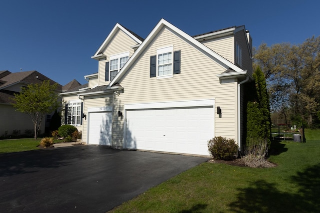 131 Glenbrook Cir, Gilberts, IL 60136 - traditional-style home with asphalt driveway, a garage, a front yard, and a chimney