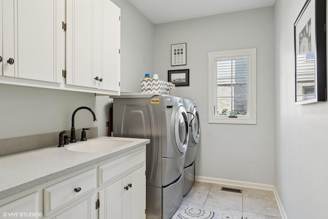8S241 Dunham Dr, Naperville, IL 60540 - laundry area with cabinet space, washer and clothes dryer, and light tile patterned floors