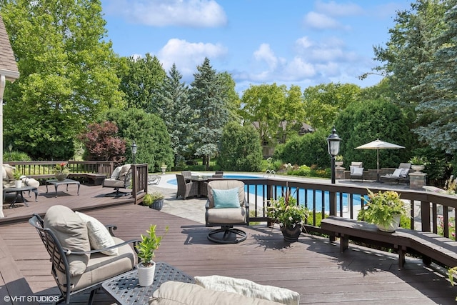 8S241 Dunham Dr, Naperville, IL 60540 - wooden deck with an outdoor pool and view of wooded area