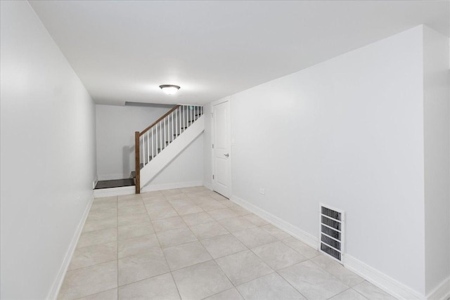 7959 S Constance Ave, Chicago, IL 60617 - unfurnished room with stairway and light tile patterned flooring