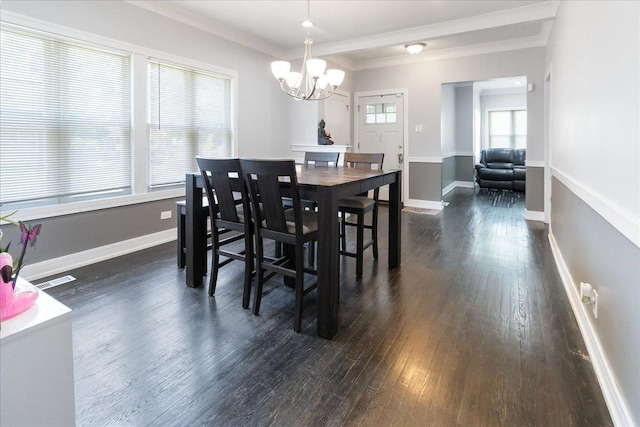 7959 S Constance Ave, Chicago, IL 60617 - dining area featuring dark wood finished floors, a chandelier, and ornamental molding