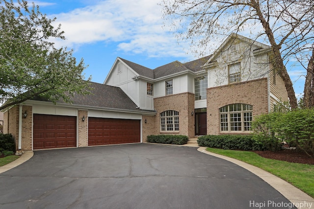 4 Shadow Creek Ct, Lake In The Hills, IL 60156 - view of front of house with a garage, brick siding, and asphalt driveway