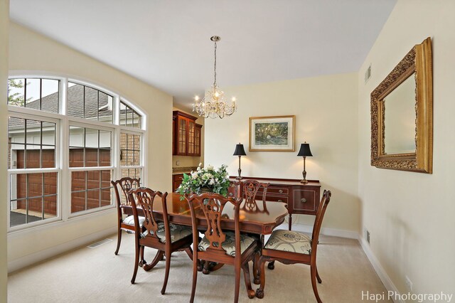 4 Shadow Creek Ct, Lake In The Hills, IL 60156 - dining space featuring a chandelier and light colored carpet