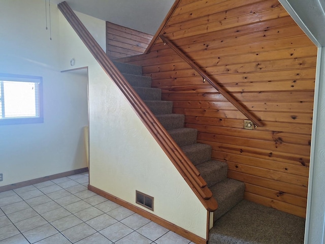 306 N Joy St, Tampico, IL 61283 - stairway with baseboards and tile patterned flooring