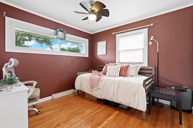 3414 Franklin St, Highland, IN 46322 - bedroom with a baseboard radiator, multiple windows, and light wood-style floors