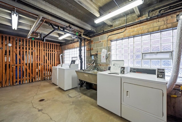 2228 Central St Unit 3, Evanston, IL 60201 - washroom with washing machine and clothes dryer and concrete block wall