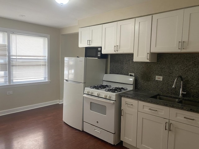 4907 Hull St, Skokie, IL 60077 - kitchen with white appliances, tasteful backsplash, white cabinetry, and dark wood-style flooring