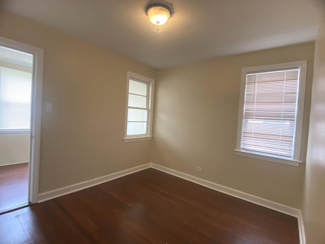 4907 Hull St, Skokie, IL 60077 - unfurnished room featuring dark wood-type flooring and baseboards