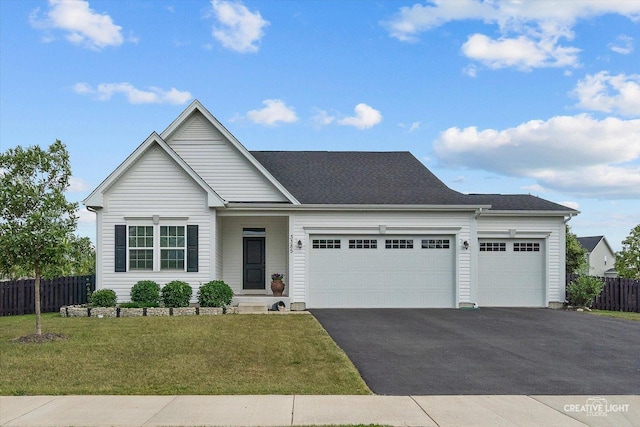 3385 Pecos Cir, Montgomery, IL 60538 - view of front of home with asphalt driveway and an attached garage