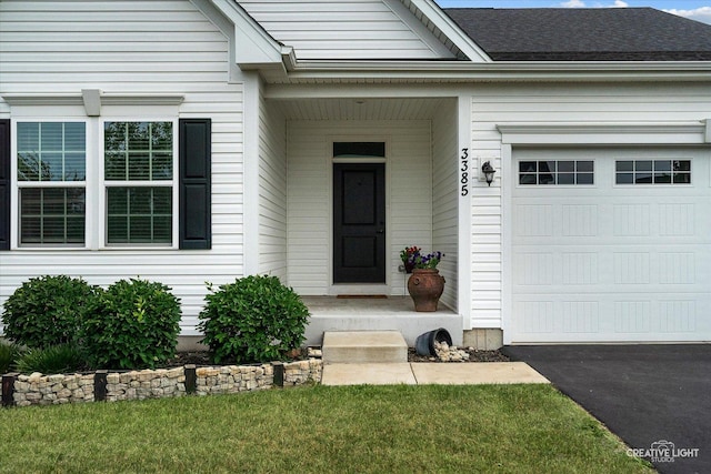 3385 Pecos Cir, Montgomery, IL 60538 - entrance to property with an attached garage and driveway