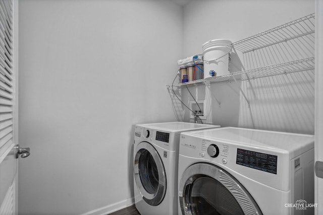 3385 Pecos Cir, Montgomery, IL 60538 - laundry area with washing machine and dryer and wood finished floors