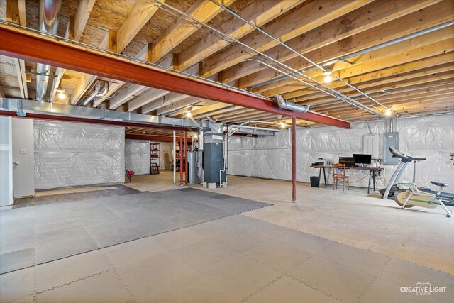 3385 Pecos Cir, Montgomery, IL 60538 - unfinished below grade area featuring electric panel and gas water heater