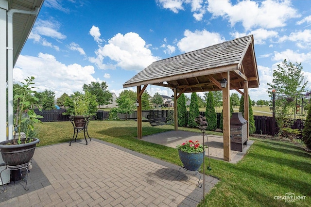 3385 Pecos Cir, Montgomery, IL 60538 - fenced backyard featuring a patio and a gazebo