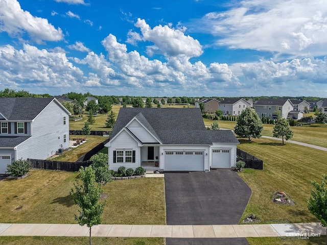 3385 Pecos Cir, Montgomery, IL 60538 - view of front facade with a garage, driveway, a residential view, and roof with shingles