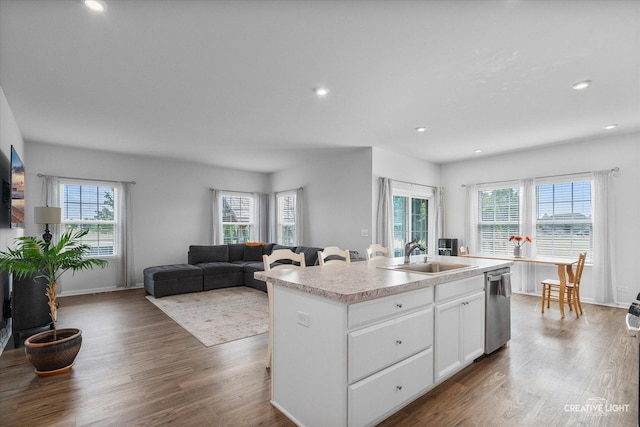 3385 Pecos Cir, Montgomery, IL 60538 - kitchen featuring stainless steel dishwasher, plenty of natural light, dark wood-style flooring, a center island with sink, and recessed lighting