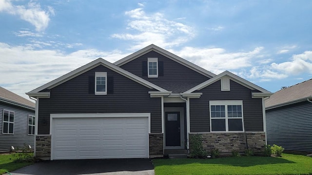 2522 Redwood Trl, Wonder Lake, IL 60097 - traditional-style house featuring stone siding, driveway, a garage, and a front yard
