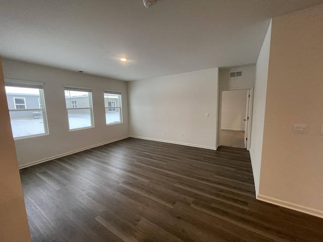 2522 Redwood Trl, Wonder Lake, IL 60097 - spare room featuring dark wood-type flooring and baseboards