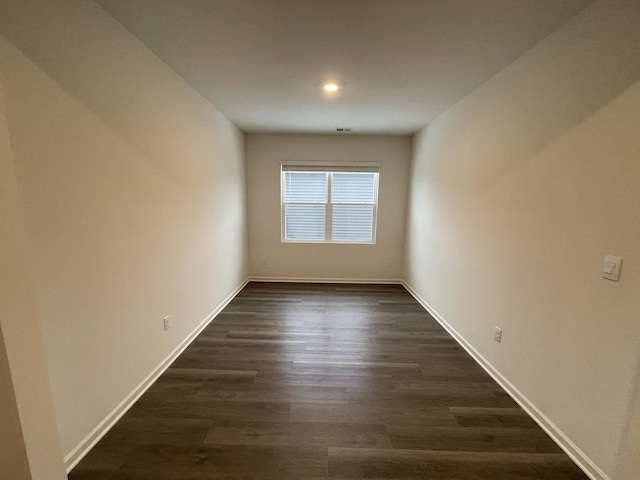 2522 Redwood Trl, Wonder Lake, IL 60097 - spare room featuring baseboards and dark wood-type flooring