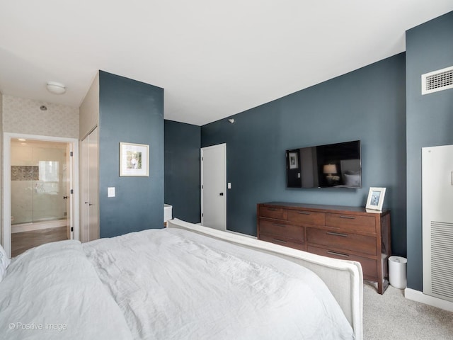 421 W Huron St Unit 1005, Chicago, IL 60654 - carpeted bedroom featuring ensuite bath and baseboards
