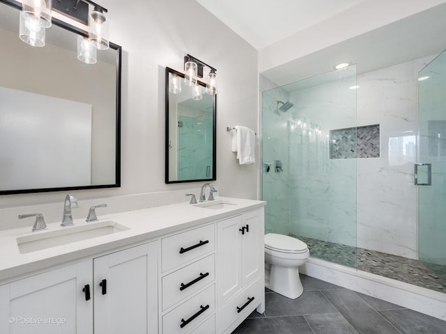 421 W Huron St Unit 1005, Chicago, IL 60654 - full bathroom featuring a marble finish shower, double vanity, and tile patterned floors