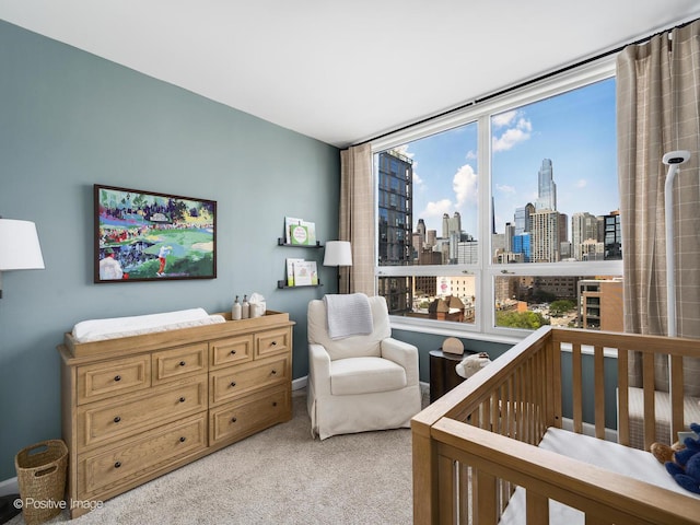 421 W Huron St Unit 1005, Chicago, IL 60654 - bedroom featuring a view of skyline, carpet floors, and a crib