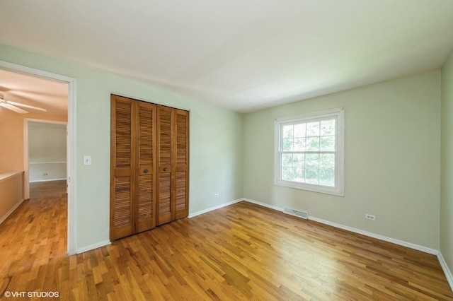 316 Ambleside Dr, Roselle, IL 60172 - unfurnished bedroom featuring light wood-type flooring and a closet