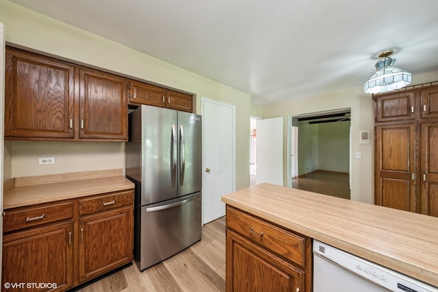 316 Ambleside Dr, Roselle, IL 60172 - kitchen featuring freestanding refrigerator, dishwasher, light wood-style flooring, and light countertops