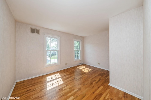 316 Ambleside Dr, Roselle, IL 60172 - unfurnished room with light wood-style flooring and baseboards