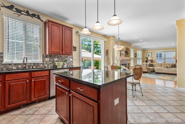 2636 Bainbridge Blvd, West Chicago, IL 60185 - kitchen featuring dishwasher, backsplash, dark brown cabinets, hanging light fixtures, and a kitchen island