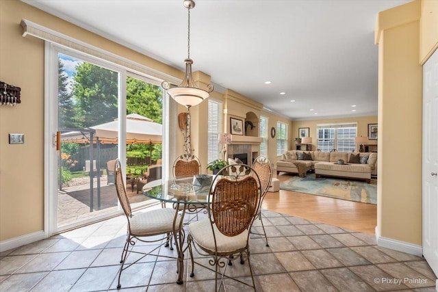 2636 Bainbridge Blvd, West Chicago, IL 60185 - dining room with a tiled fireplace, recessed lighting, and crown molding
