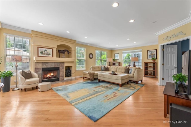 2636 Bainbridge Blvd, West Chicago, IL 60185 - living area featuring crown molding, a fireplace, light wood finished floors, and recessed lighting