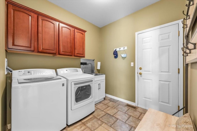 2636 Bainbridge Blvd, West Chicago, IL 60185 - laundry room featuring washer and clothes dryer, cabinet space, and stone finish flooring