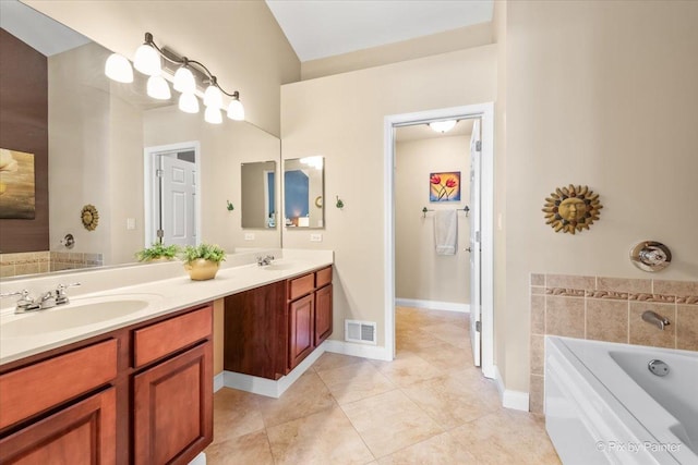 2636 Bainbridge Blvd, West Chicago, IL 60185 - bathroom with double vanity, a bath, and tile patterned floors