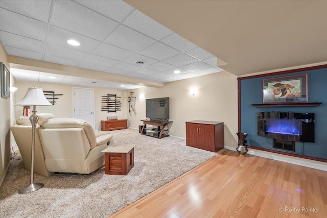 2636 Bainbridge Blvd, West Chicago, IL 60185 - living room with wood finished floors, a glass covered fireplace, recessed lighting, and a paneled ceiling