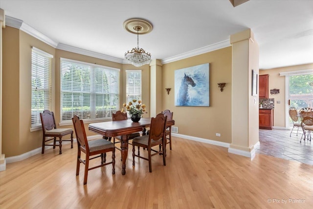 2636 Bainbridge Blvd, West Chicago, IL 60185 - dining area with crown molding, light wood-type flooring, and a chandelier
