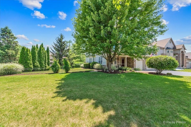 2636 Bainbridge Blvd, West Chicago, IL 60185 - view of yard featuring a garage and driveway