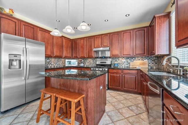 2636 Bainbridge Blvd, West Chicago, IL 60185 - kitchen featuring stainless steel appliances, a kitchen island, under cabinet range hood, and decorative backsplash