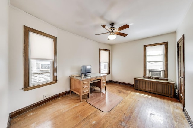 6339 S Kostner Ave, Chicago, IL 60629 - home office with radiator heating unit, a ceiling fan, light wood finished floors, and cooling unit