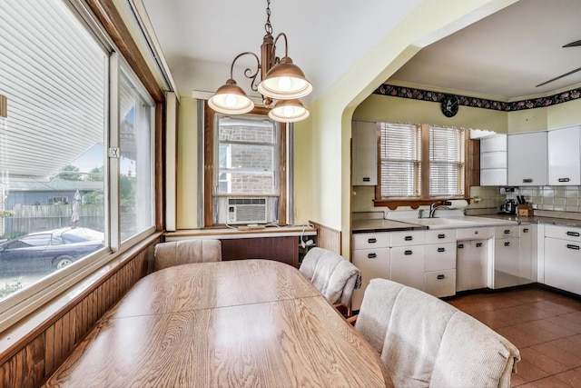6339 S Kostner Ave, Chicago, IL 60629 - dining room with dark tile patterned floors and cooling unit