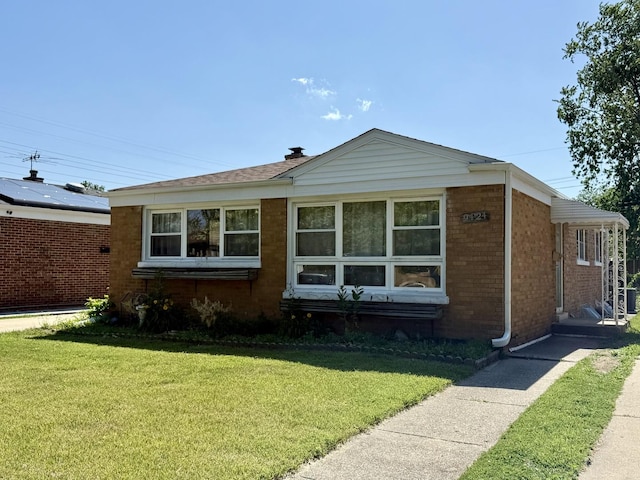 9424 Lorel Ave, Skokie, IL 60077 - view of front of property with a front lawn and brick siding