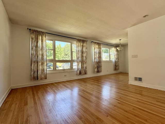 9424 Lorel Ave, Skokie, IL 60077 - unfurnished room featuring wood finished floors and a textured ceiling