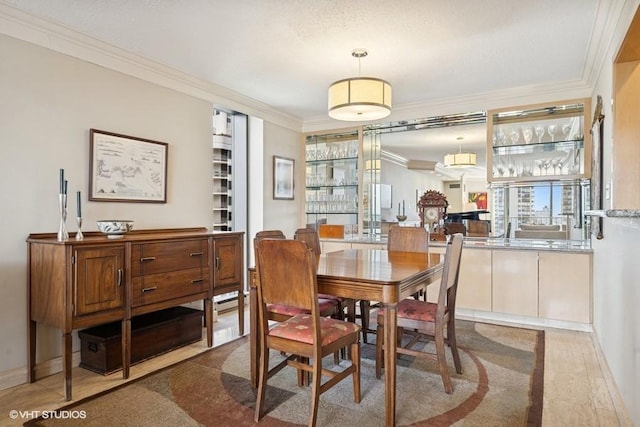 1440 N State Pkwy Unit 21C, Chicago, IL 60610 - dining space featuring ornamental molding and a baseboard heating unit