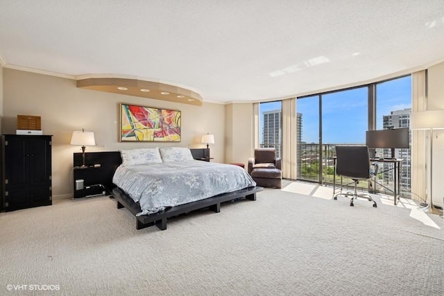 1440 N State Pkwy Unit 21C, Chicago, IL 60610 - carpeted bedroom featuring expansive windows, a desk, access to exterior, and ornamental molding