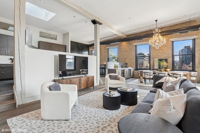 401 N Aberdeen St Unit 4S, Chicago, IL 60642 - living room with wood finished floors, a chandelier, brick wall, a skylight, and beamed ceiling