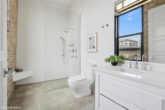 401 N Aberdeen St Unit 4S, Chicago, IL 60642 - bathroom with vanity, a walk in shower, and brick wall