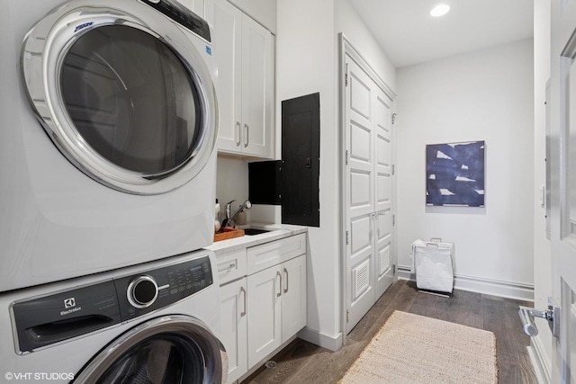 401 N Aberdeen St Unit 4S, Chicago, IL 60642 - washroom featuring cabinet space, stacked washer / dryer, dark wood-type flooring, and recessed lighting