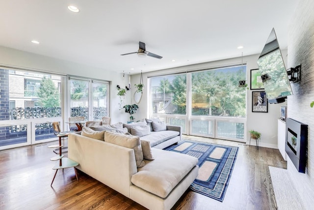 1800 N California Ave Unit 1E, Chicago, IL 60647 - living area featuring wood finished floors, a ceiling fan, a glass covered fireplace, and recessed lighting