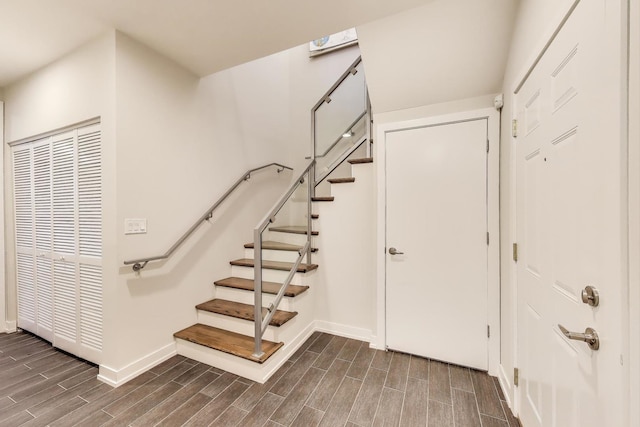 1800 N California Ave Unit 1E, Chicago, IL 60647 - staircase featuring baseboards and wood finish floors