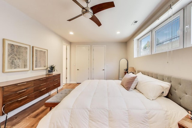 1800 N California Ave Unit 1E, Chicago, IL 60647 - bedroom with recessed lighting, light wood-style flooring, a ceiling fan, and two closets